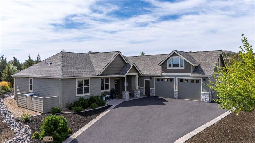 Discover unparalleled  resort style living in this exquisite Custom Northwest style golf course home located on the 8th Fairway of the Challenge Course in The Falls 55+ community on a tranquil cul de sac. This single level 4 bedroom, 2.5 bath residence offers an inviting open floor plan perfect for seamless indoor & outdoor entertaining. Highlighted by vaulted ceilings, custom built ins and showcase fireplace the great room is ideal for relaxation and entertaining. Laundry room/ butlers pantry provides ample storage space  Wall of windows provides abundant natural light as well as showcasing the private, professionally landscaped backyard with custom bocce court, fire pit, serene water feature and covered patio perfect for al fresco dining. The chef's kitchen boasts a large soapstone island, breakfast bar & quartz counters and pantry. This home offers separation between primary and guest bedrooms and  spacious bonus room above the oversized 2 car garage with workshop area.