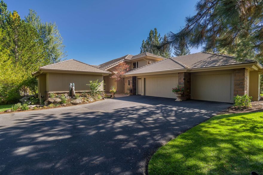 Stellar views from the green all the way down the12th fairway from this gorgeous Steve Madsen home. Contemporary Northwest design and finishes create a sense of fresh, sleek sophistication with windowed walls allowing natural light to spill throughout each room, while the sand-in-place beechwood flooring adds the perfect touch of warmth and coziness. Extensive remodel by Madsen Homes includes a main-level primary suite retreat with golf course views and spa-worthy bath, a jr. primary suite is also on the main level with an additional full primary suite w/ golf course view balcony and a  private office/library with gas fireplace up. Open concept great room is accented by cantilevered bookcase niche and floating fireplace w/ stacked rock surround. Carrara marble backsplash highlights the gourmet kitchen with double ovens, induction cooktop, 2 drawer Fisher Paykel dishwasher and breakfast bar. Even the garage is fabulous with epoxy flooring and a separate 3rd bay that includes heat & a/c