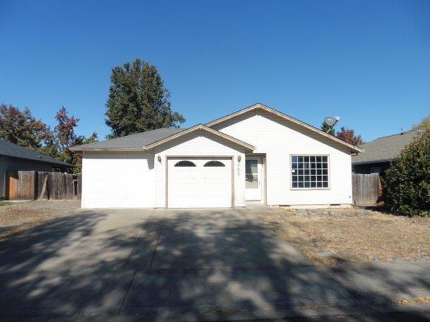 Lots of potential in a great location in Central Point. Large lot offers mature trees and a covered patio along with a 1 car attached garage. Inside offers a large, bright living room that leads to a dining area and kitchen. 2 nice sized bedrooms and one offers a huge walk in closet. Don't hesitate!!!