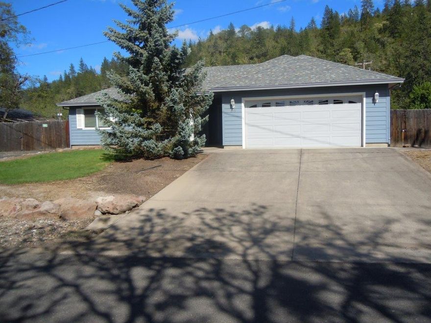 Beautiful well kept home in a fantastic neighborhood in Shady Cove. The mighty Rogue River is close from this charming home. Boasting close to a quarter of an acre in town, there is plenty of room for your RV, toys, garden or pets. With 3-bedrooms, 2-full bathrooms, an open floor plan, over 1,600 sq. ft. of living space and a two car garage, this one won't last long!