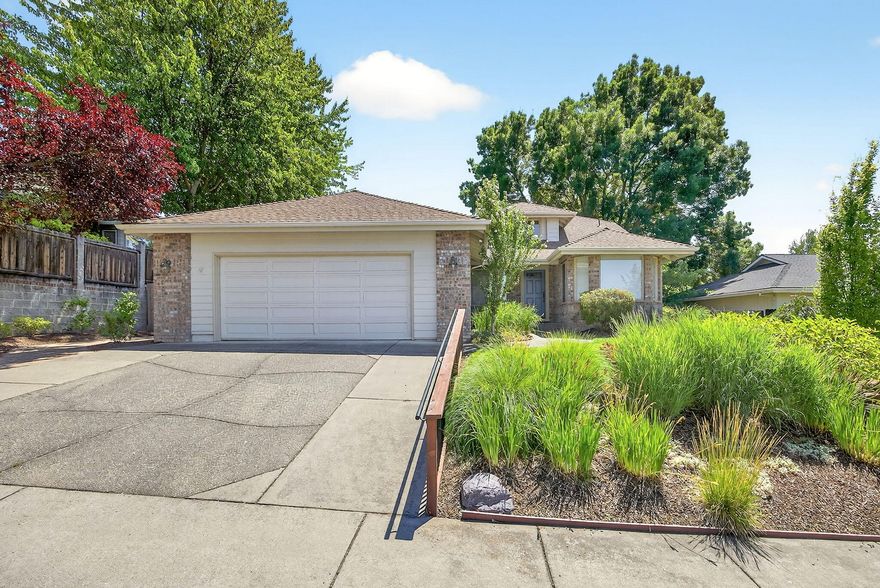 Wonderful East Medford Gem. This beautifully maintained home offers a spacious, open layout with soaring vaulted ceilings and tasteful upgrades throughout. The upgraded kitchen features stone countertops, a gas stove, soft-close cabinetry, and sleek upgraded appliances—perfect for everyday living or entertaining. Enjoy custom windows and custom powered shades in both the dining area and updated primary suite. The large primary bedroom boasts a spa-like bath with a walk-in shower and a soaking tub as well as a walk-in closet. The garage includes a built-in workbench and extra storage, while the private backyard is ideal for relaxing or entertaining on the beautiful deck under the Sunbrella awning. This home checks all the boxes—style, comfort, and convenience. Don't miss your chance, schedule your private tour today!