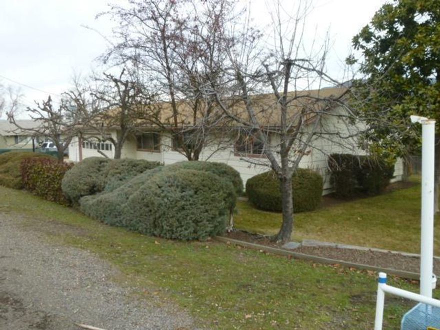 If you are looking for a property that can also serve as HQ for a home-based-business then this may be the one. Located at the corner of Talent Ave. & Creel Rd. in Talent, this home consists of 1,288 sq ft of living space plus an addt'l, 1,100 sq ft of garage & shop space that is currently used as a legal home-based-business. The ranch-style house consists of 3bd & 1ba & sit on a .19 ac fully landscaped lot. All appl. come with the prop. There is a sun room in the back of the house with a working water feature nearby. The yard is fully fenced & comes with TID irrg. rights & sprinkler system. The garage-shop area can be used for any purpose. The bus. area consists of a separate outdoor entrance & addt'l parking spaces comes with the bus. Its current use is a custom wood cabinet shop. RVTD bus stop is next to property. Easy to show. Take a look for yourself