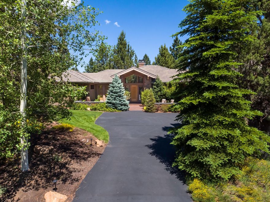 Elegant single level NW contemporary home, on the ridge overlooking the 8th fairway at Broken Top. Designed by the acclaimed Architect, Neal Huston, the home features a welcoming courtyard and grand entry. Open and light-filled, the great room has vaulted ceilings & lots of windows. Perfect for entertaining, the spaces flow together...dining area, wet bar, breakfast nook and kitchen. The latter features honed granite counters, an island, a stainless breakfast bar, and a Butler's pantry. Beautiful bamboo flooring and new carpet in the great room and primary suite. The master bath features travertine, a jetted tub and His & Hers closets. Spacious bedrooms & bathrooms & 2 powder rooms. Office could be 4th bedroom. The back deck is private and peaceful, with views of the golf course. Both natural & landscaped, the .71 acre lot offers a spacious retreat. Attached 3 car garage. Great location, close to the Broken Top amenities, mountain biking trails, Downtown Bend, & the road to Mt Bachelor