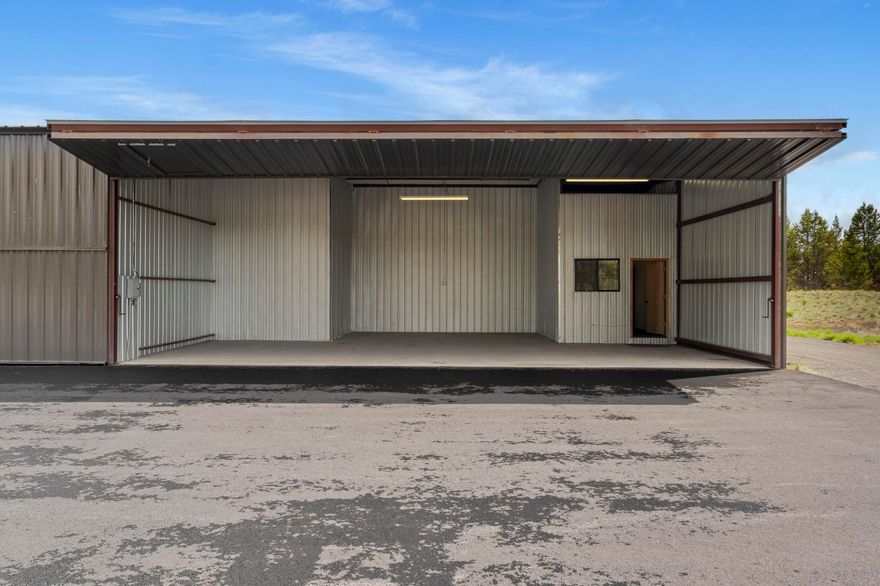 Rare Sunriver Hangar Opportunity! Calling all pilots and adventure seekers—here's your chance to own a highly sought-after 1,597 Sq. Ft. end unit hangar in Sunriver! This versatile space includes an approximately 40' wide x 33' deep hangar bay with a door height of  approx. 11.5', perfect for storing your aircraft. Attached is a 13' x 9' office and a convenient 13' x 9' loft storage area above, accessible by stairs on the storage side. Office has a wall heater.  A separate two-bay garage offers approximately 20' x 18' of space with an approx 9' tall door—ideal for vehicles, recreational gear, or additional storage. These connected units are being sold together and will not be offered separately. A rare find in a prime location—don't miss out!