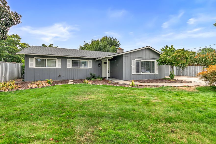 Wonderful entry-level home in quiet Central Point neighborhood! Enter into a sizeable living room w/ cozy fireplace for relaxing evenings. Spacious kitchen includes all appliances, perfect for family meals. Main bath features tile floors & tub surround for easy maintenance. Out back, enjoy a very large, fenced yard w/ ample space for a pool, kids' play, & pets to roam. Room for RV parking adds convenience. 2-car garage has two built-in rooms that can be easily removed for full use. Ideal starter home—move-in ready & full of potential!