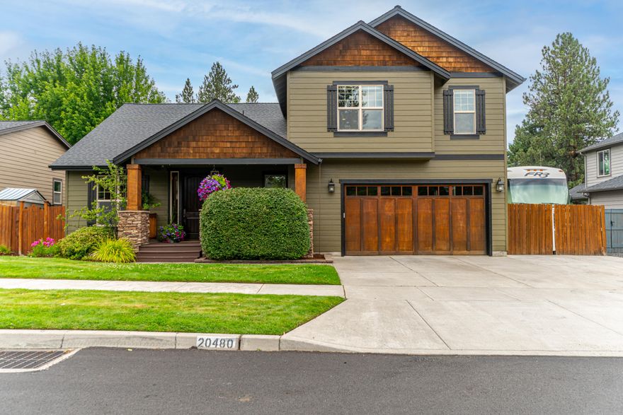 Welcome to this lovely SE Bend home loaded with curb appeal & thoughtful details including RV parking, 3-car garage, bonus room and a dedicated office just inside the front door. The open concept living area features lofty vaulted ceilings & well designed kitchen with bar seating at the large island plus plentiful counters & custom cabinetry. Vaulted ceilings also accent the main level primary suite which includes a large bath with dual vanity & soaking tub. Upstairs, a generously sized bonus room provides space for work, play or both. Two bedrooms & a full bath complete the upper level. Enjoy meals on the covered patio surrounded by a backyard with mature trees & shrubs for a lush, natural privacy screen. With plenty of lawn, a second patio area & already set up for a hot tub & outdoor projection screen, this is the perfect getaway for everyday life. An extra large tandem space in the 3-car garage plus a gated 45' RV parking spot make this a one-of-a-kind find!