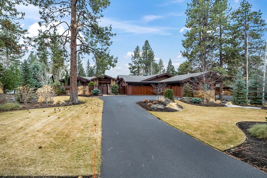 Stunning Norman built home in Broken Top! From the moment you enter through the gated courtyard through the beautiful leaded glass doors, the stunning great room windows showcase the golf course setting, and you know this is a special home. Mahogany ceilings, doors, cabinets and Acacia wood floors throughout. Floor-to-ceiling stacked stone fireplace in the great room with beautiful exposed beams and Western Walnut cabinetry. Gourmet kitchen boasts custom mahogany cabinetry, large cooktop island, slab granite countertops, 2 kitchen sinks with disposals, Décor 6-burner gas range & double ovens, built-in Subzero, Miele coffee maker, wine cooler & built-in beverage drawers. Luxurious master with Onyx surround fireplace, his & her baths and closets, plus private covered patio. Box beamed office with gorgeous built-ins. Media room with stacked stone fireplace. Two en suites at the opposite end of the home. Covered patio with ceiling heaters, Wolf BBQ & fireplace. One-of-a-kind!