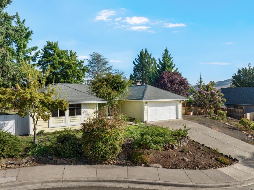 Tucked away on a quiet East Medford cul-de-sac, this inviting 1,704 sq. ft. single-level home offers functional updates including new exterior paint, a tastefully remodeled
kitchen, new flooring in the living room, and much more. The three bedroom, two bath layout is comfortable and well-designed, complemented by a spacious two-car
garage for parking and storage. The landscaped .23-acre lot has recently been upgraded with new fencing and includes an array of perennials and sprinkler irrigation. The property has been meticulously maintained and cared for — and boasts scenic views of Mt. Ashland and the surrounding valley. Located just minutes from Centennial Golf Course, Roxy Ann Peak, and other local favorites, this home is a great fit for anyone looking to enjoy peaceful living in a desirable neighborhood.