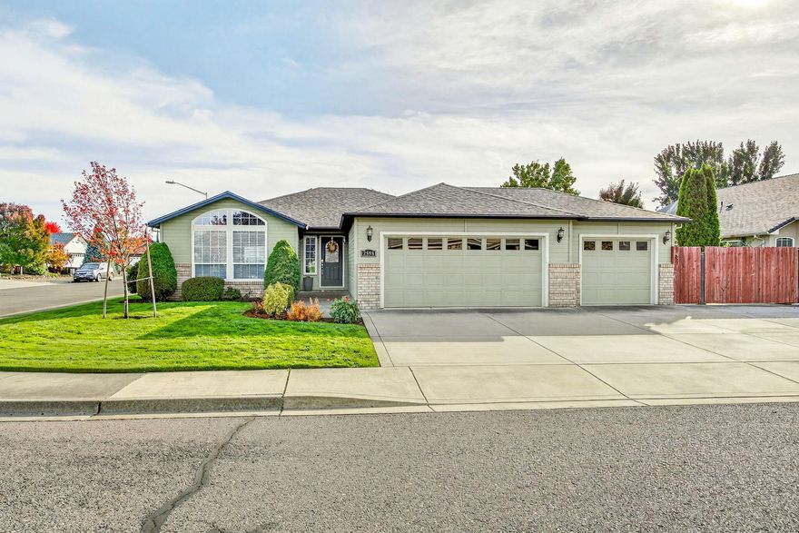 Charming home on a corner lot in New Haven estates! This home combines comfort, extra room and practicality! Enjoy entertaining in the open kitchen with granite countertops and real wood flooring. All the appliances are included. The dining area is spacious enough for a large table as well as seating at the counter. Use the bonus space for an office, reading nook or hobby room. The living room has a beautiful, upgraded, remote-operated gas fireplace and a tv mount above. Travertine flooring throughout the entry and dining area. The primary bedroom has a large walk-in closet, double sink vanity and a step-in shower. The backyard is perfect for entertaining with a large patio and shaded pergola. There is a shed for storage. The big updates are already done! New roof in 2023, new hvac system in 2018 and new gas water heater in 2022. The parking at this property is fantastic! There is a 3-car garage, lots of driveway spaces and large r.v parking behind the gate! So much to offer!