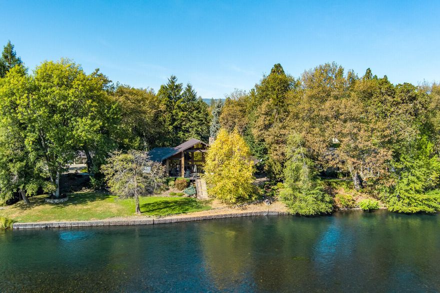 Spectacular Rogue River Estate. Impressive 3-bedroom, 2-full bathroom, 2-half bathroom, 3,220-sq. ft. upgraded home features cathedral ceilings, soaring floor to ceiling windows with expansive river views, hardwood and tile floors, granite countertops throughout, Chef's kitchen include high-end Thermador appliances, floor to ceiling river rock fireplace, large covered deck located on rivers' edge for maximum river life enjoyment, East facing for hot summer day shade, 2.66-acres, 200-feet of Rogue frontage, great fishing, river irrigation, good well with water treatment, 3-car finished garage, blacktop entrance and on and on! Must tour to appreciate.