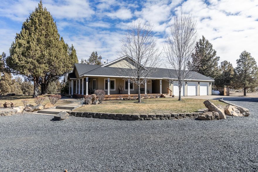 Privacy abounds in this beautiful 10 acre setting just minutes East of Bend, where you feel like you are in your own oasis.  This single level home invites you in, wrapped in decks to take in the scenery.  Featuring an open floor plan with vaulted living room and high ceilings throughout.  The spacious master suite is separate from the other bedrooms.  Chef's dream kitchen with double oven, granite tile counters, travertine floors, pantry and plentiful cupboard space, separate stand up freezer and 3 large windows taking advantage of views to water feature with double falls.  Finished 3 car garage with built in storage accessed through breezeway from mudroom/laundry.   Large shop/RV garage 24 by 40' with loft.   Property includes a quality built 10x16' shed  and gun/archery range. Appt required to drive onto property.