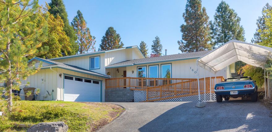 Move-in ready home looking out over quiet wooded neighborhood in NW Grants Pass.  Quality laminate floors through-out, wonderful kitchen, lot of light, spacious laundry room/pantry. Relax on the covered patio in your own park-like yard. Downtown shopping is just down the hill.  For the outdoorsman, Dollar Mountain trailhead is literally around the corner, and the Rogue River is just minutes away.  Many recent updates including 50-year roof, permitted cedar ramp for easy access, premium vinyl windows, heated, finished 2 car garage. New electrical panel. There is a covered patio with new roof. 3 backyard sheds, brand new exterior paint!  This is your forever home. Call for a look inside today.