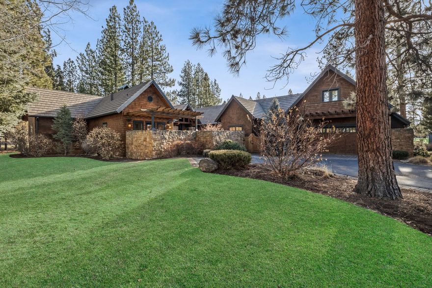 Single level Broken Top home, by designer Jim Rozewski, artfully incorporates influence of iconic Greene & Greene architecture. Montana Mossy Rock enclosed courtyard provides an expansive outdoor room, from which to enjoy the stars or morning sun in front of fireplace. Inside you will be impressed by great room's soaring vaulted ceilings, rustic beams, detailed metal work & wood burning/gas fireplace framed by mossy rock from floor to ceiling peak & an alcove overlooking parklike setting along 4th fairway. Spacious kitchen features double ovens, wine fridge, brkfst bar, island w/cooktop, garden window, walls of cabinetry & incredible butler's pantry w/ sink, cabinetry, pantry & access to enc courtyard w/ doggy door. Primary suite inc. private office, bedroom w/fireplace, walk-in closet, bath w/ dual sinks, tub, steam shower, vanity, heated floors & courtyard access. Guest wing features hallway of windows leading to two full en-suite bedrooms & den. Exercise room & studio apt w/ktchnett