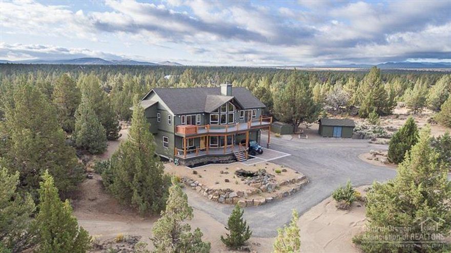 The best of Central Oregon country living is here in this beautiful one owner home on low maintenance 9.25 acres. Quality throughout. Huge great room, separate living room w/vaulted pine ceilings & wood fireplace, kitchen w/island, alder cabinetry, granite counters, family room, 4 bdrms, 3 baths. Master suite has walk-in closet, open tile shower, jetted tub, slider to deck & hot tub. Approx. 1,100 sq.ft. of decking w/great mountain views. This private, peaceful & quiet sanctuary in the country can be yours