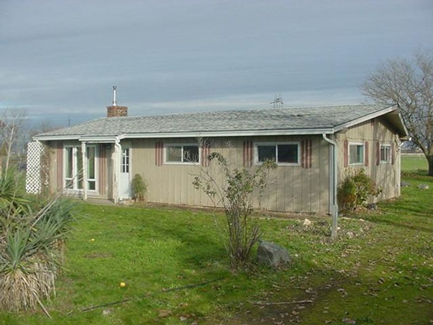 Nice property in Central Point. Has just under an acre (.89) Quite country feel just minutes from town though. Has tile flooring in dining,kitchen & bath. Some tongue and groove ceilings. Good size bedrooms. Property has lots of potential.