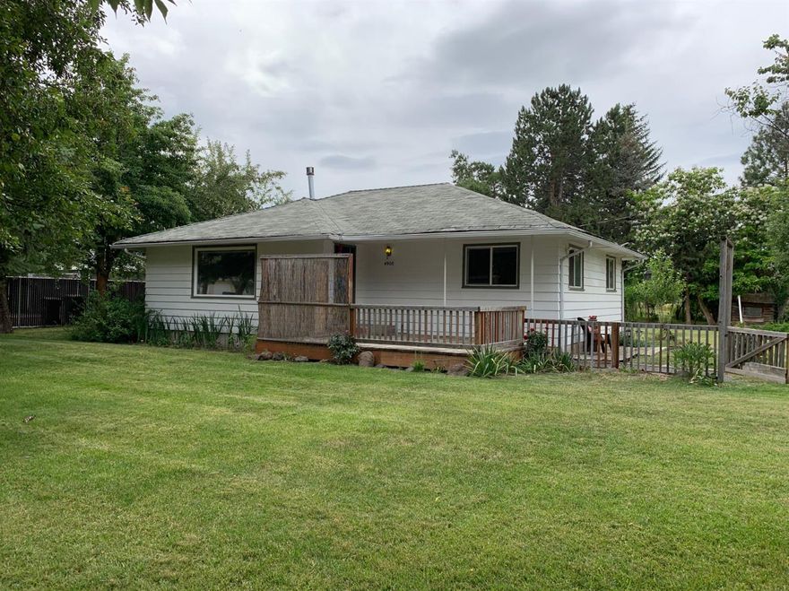 Beautiful country cottage feel at this 2/1 located in quaint neighborhood. Close to hospitals,parks and shopping. Owner has recently replaced all water lines with PEX from meter to house and has added natural gas lines if you want to change kitchen stove to gas its all there just hook up and go. House sits on .74 Acres and is KID Irrigated (Owner will leave pump.) and comes with and additional 2.13 Acres of vacant property owner used as horse pasture. with a horse shelter on premises.Freshly painted and ready for your personal touches. Call your agent today to schedule your personal viewing.