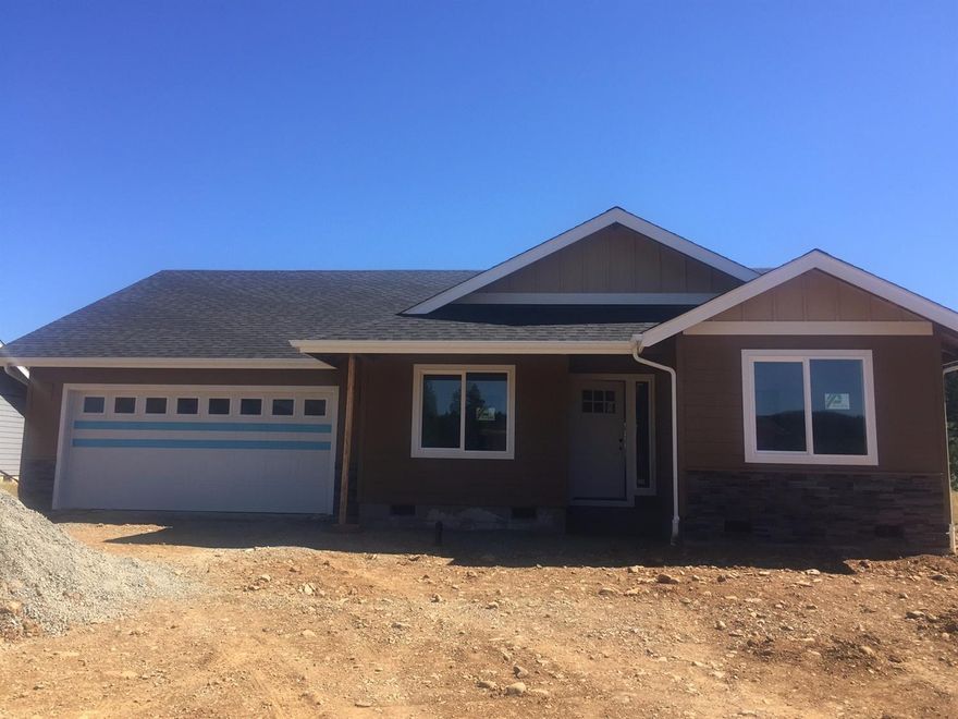 Come experience your new home in this exclusive private gated Illinois River front community! If quality of life and quality construction are important to you, you'll love the workmanship in this nearly completed home built by renowned builder Jacoby Homes. From the moment you wake each morning you'll feel the peaceful serenity of both your new home, and the secluded surroundings of the occasional soaring eagles flying overhead. If you love fishing, just take a few steps from your home and you are at one of the best steel head holes on the Illinois River. This home itself comes complete with vaulted ceilings, pearwood flooring, granite counter tops, mosaic tile back splash, stainless steel appliances, natural finished cabinetry, oil rubbed bronze fixtures throughout and an open great room floor plan. The community also offers a secured RV parking area for your recreational needs. Come take a look. Photos don't do this home justice!