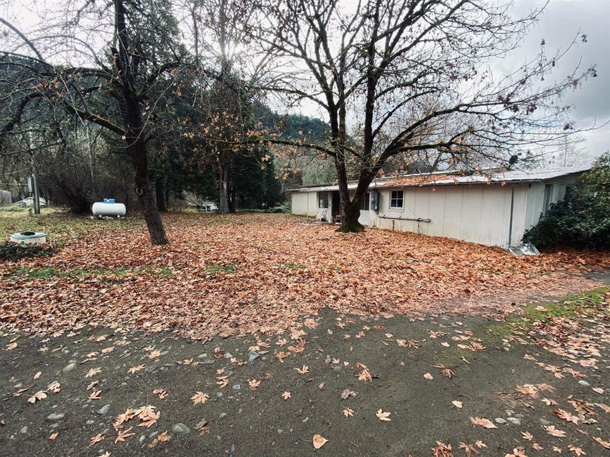Check out this awesome property that sits on a large 1.12 acre lot close to the beautiful Rogue River and surrounded by serene views. It is gorgeous any time of year! For the price you're getting two mobiles! One of which is the main home that is currently tenant occupied and is 1200 sf with 3 bedrooms and 2 bathrooms. Has a good sized backyard. Perfect for entertaining or for your furry friends to run wild. The other is 1040 sf with 2 bedrooms and 1 bathroom. The property has a well and 2 septic tanks one of which is a sand filtration tank. Don't miss out on this amazing property!