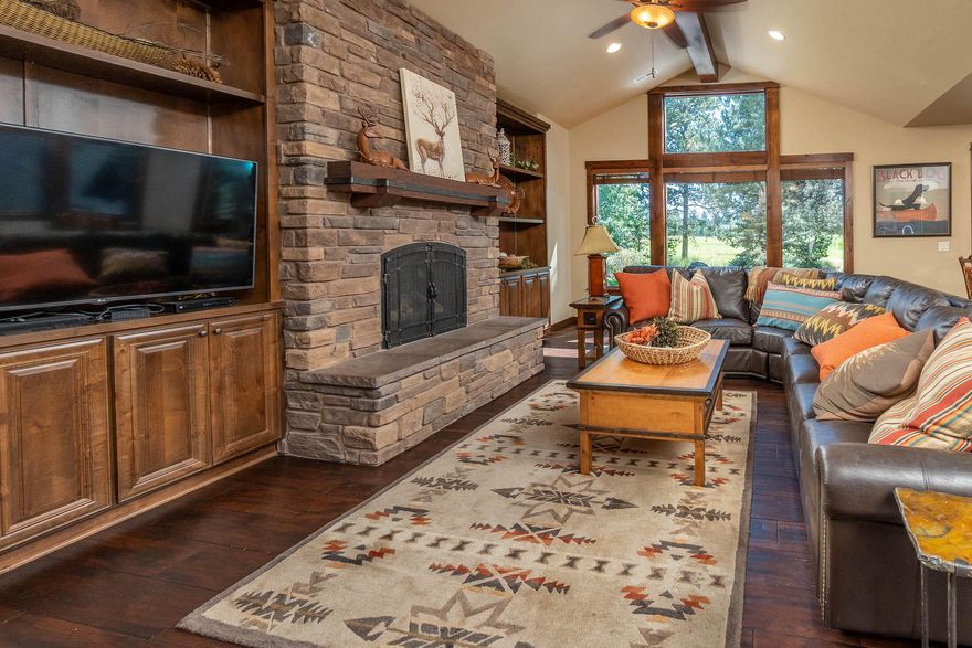 Caldera Cabin with views of Caldera Links executive golf course! High end features throughout, including gourmet kitchen with slab granite counters, knotty alder cabinets and gas cook top with copper hood. Vaulted ceilings in the great room, gas fireplace with raised hearth and built ins. 3 master suites downstairs, plus an office/sitting room. Additional suite upstairs includes two built-in bunk beds and a bonus area. Outdoor living space with covered patio, hot tub and views of the golf course. Private driveway leading to a 2 car garage.