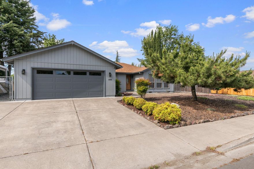 This is a very well maintained home in a great Southwest Medford neighborhood. This 3 bed 2 bath home is 1,429 square feet and has had some recent updating. The home has all new matching laminate flooring throughout and a fresh coat of paint inside and out. The living area, kitchen, dining room and 3rd bed/office feature can-lights for a bright and comfortable feel. All countertops, including the kitchen, bathrooms and oversize laundry room w/sink have nice granite slabs. The HVAC is also newer. The exterior features xeriscape landscaping for easy low maintenance and a newer fence along the Northern property boundary. There is also a nice large gated RV parking area to the west of the garage. Call today to schedule your tour!