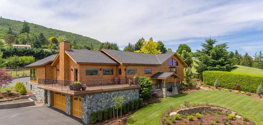 Remarkable custom home on 2 lush ir ac. just mins from downtown Ashland. Remodeled in 2011, this knoll top property takes advantage of the fantastic East Hill & pastoral views. Incredible detail & quality were used throughout for a top of the line experience. Solid hardwood flooring & doors, vaulted, beamed ceilings, high-end wood windows, trim & base, stone & marble counters, 3 fireplaces + multiple skylights add to the ambience. Sensational island kitchen features tongue-groove cathedral ceiling, Wolf range, 2 Sub-Zero refrigeration systems, custom cabinetry, walk-in pantry & fantastic views. Main level dream suite boasts huge wardrobe rm and & spa like bath. Stunning 876 SF greenhouse attached to great room lets you live inside-out yr.-round. Family room, office, exercise pool & much more. 2nd guest suite. All easily accessed from personal elevator. Mechanical systems include geo-thermal heating/cooling + whole house water filtration & automated back-up generator.