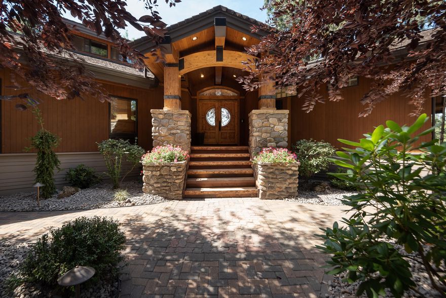 WAKE UP TO SOUNDS OF THE RIVER AND TOWERING PINES 3618sf custom home on a .84 ac overlooking the deschututes. Vaulted great room plan w/beamed ceilings and knockout view of the river & beyond. Plank, wood flooring evokes a western spirit as the view continues through 2-story windows. Light, open kitchen welcomes the view and offers stainless appliances, granite, and a breakfast island.  Even a passthrough window adds convenience to outdoor cooking area and dining. Master has a decadent/spa-like bathroom and walk-in closet.  Other amenities include potential in-law quarters, large, oversized attached garage plus detached shop or 2nd garage. Relax while staying onsite with exterior upgrades like the outdoor kitchen, lux home theatre and hot tub poised perfectly for sunset views. This home lives like a private retreat with endless opportunities for year round, Central Oregon adventure.  Footsteps out the door to explore Lava Island Falls, Mt. Bachelor, & high lakes are just a quick jaunt.