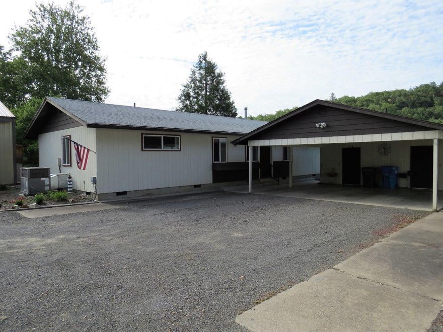 Looking for a two-family place with a shop? Here it is! Located just outside of Eagle Point on .75 acres. The main home, built in 1979 is frame construction 1280 sqft with 2 bedrooms, 2 bathrooms, spacious laundry/mud room and a great yard. Large shop for those projects and storage! Double carport with two storage rooms between the main home and the second home. The second home is a 1989 manufactured home with 924 sqft, 2 bedrooms and 2 bathrooms. It has its own fenced yard with a few garden beds. The property does have irrigation from Little Butte Irrigation! Level small pasture for a few animals or 4-H projects!