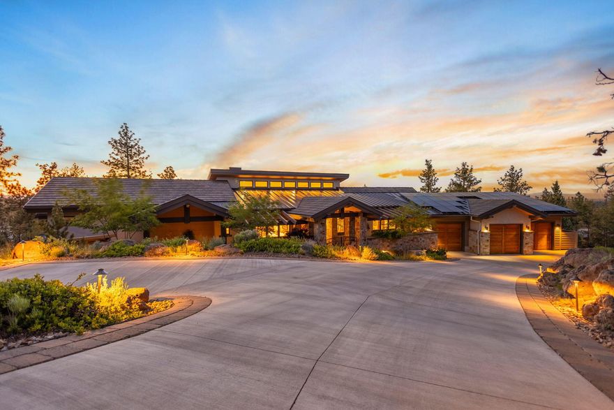 Discover radiant Cascade Mountain views from this luxurious single-level home in the gated North Rim community. Within the front courtyard, tranquil waterfalls & stream lead to stunning interiors. High ceilings & windowed walls in great room showcase breathtaking views. Spend cozy evenings by the fireplace or open the patio doors to enjoy fresh mountain air & starry skies from expansive deck. Chef's kitchen features double ovens, gas cooktop, pantry, island w/ 2nd sink, bar seating, & wine fridge, ideal for hosting in nearby dining room. The custom theater, w/ soundproofing & dedicated sound system, & office w/ custom cabinetry & patio access, provide functional luxury. Serene primary suite features a cozy fireplace, spacious walk-in closet, & bath w/dual vanities, make-up vanity, tub, & curbless shower. 2-Full En-Suite guest rooms offer sumptuous accommodations. Oversized garage, solar panels & high-efficiency utilities. North Rim amenities inc. Lodge, tennis/pickleball court, & park