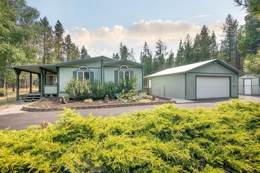 Heart of Central Oregon's Most Fabulous Recreational Areas -- Minutes to Deschutes River -- 1 Level -- UPDATED & REMODELED -- Nearly an Acre of Usable Land -- PRIVATE & SECLUDED -- 3 Bedroom / 2 Bathroom -- 1796 Sqft -- Living Room w/ Pellet Stove -- Kitchen w/ Quartz Counter Tops -- Dining Area -- LARGE Primary Bedroom w/ Bathroom & Walk-in Closet -- Laundry/Mud Room -- Vinyl Windows -- Vaulted Ceiling -- Skylights -- Ceiling Fans -- Forced Air -- Covered Porch -- Covered Deck -- 24' x 24' Detached Garage -- Additional Outbuilding / Woodshed -- Fenced Yard -- Garden Space -- Paved Circular Driveway -- RV Parking -- Private -- Trees -- Great for Year Round Living or a Vacation Home/Property