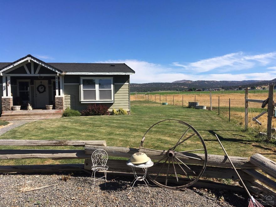 Breathtaking views, end of road privacy, 4.96 ac w/irrigation. Large 4 bedroom 3 full bath home w/office/bonus room. Master suite w/soaking tub, separated from additional bedrooms Back deck offers great entertaining space. Bring your animals