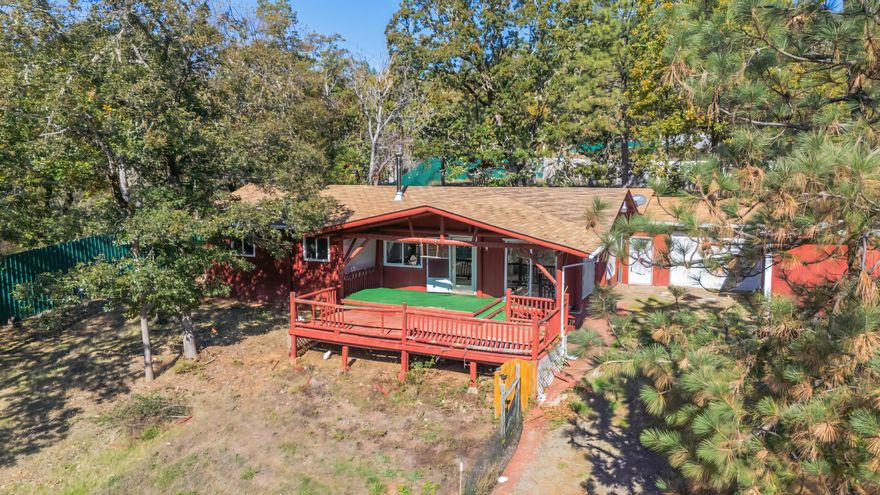 Step into this beautiful 1,200 sq. ft., two-bedroom, two-bath home with stunning mountain views! Enjoy modern living with vinyl flooring and carpet throughout. The detached two-car garage, equipped with workbenches, shelves, water, and power, is perfect for projects. A spacious metal barn and two additional metal buildings provide ample storage or workspace, complemented by a shop with a breezeway. The partially fenced property features a solar-powered gate and backs up to BLM land for privacy and outdoor exploration. A great producing well ensures self-sufficiency. This is your opportunity to own a versatile mountain-view retreat!