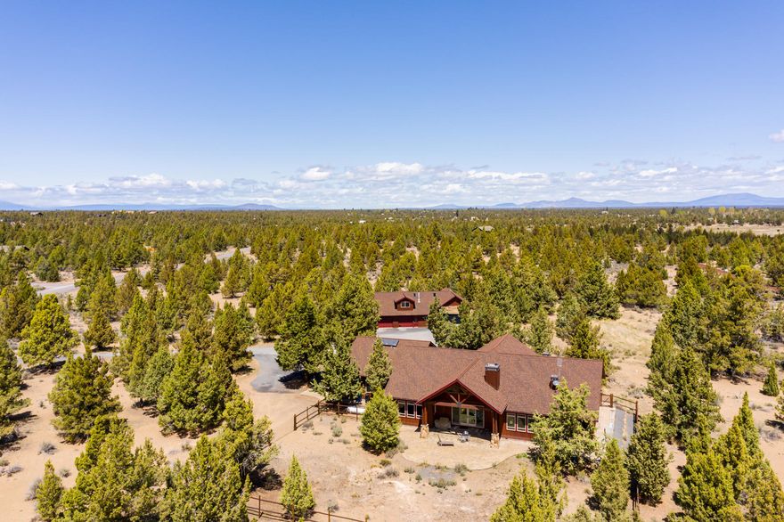 Peace & quiet surround this gorgeous 3200 SF single level custom built home on nearly 10 acres, just minutes from Bend's Eastside. Exquisite attention to detail & high-end materials create a home built equally for beauty & sustainability. Inviting great room features gorgeous exposed trusses & cedar ceiling, woodstove with soapstone hearth, wet bar with copper counters & dual slider door to paver patio. Hickory wood floors flow to the chef's kitchen complete with Sub Zero refrigerator, Wolf stainless double oven/gas cook top & range + 2 dishwashers. Italian soapstone counters & large butcher block island top of this dream kitchen. Spacious master suite has gas fireplace, 2 walk-in closets + walk-in shower & soaking tub. Two additional bedrooms & bathrooms + office & oversized 3 car attached garage. Large shop features 1550 SF studio guest quarters with full bath, kitchenette, mt views from deck, 2 garage doors & covered RV parking. A must see!