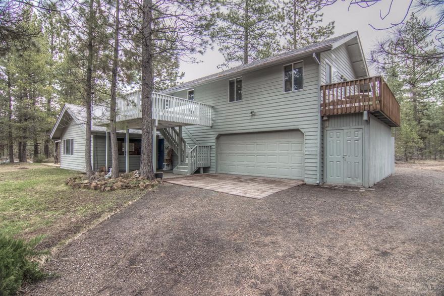 Ultimate Ski Cabin, closest to Mt. Bachelor! Originally designed as a vacation getaway. This cozy 4 bedroom, 3 bath home plus loft, has vaulted ceilings, wood beams, pine paneled walls, pecan cabinets that give it a rustic feel. The home has two balconies and sits high on the private elevated lot. It is barely visible from the street. Heated two car garage. Outside rock BBQ. Seasonal pond. Close to Sunriver. No Home Owners Association fees.