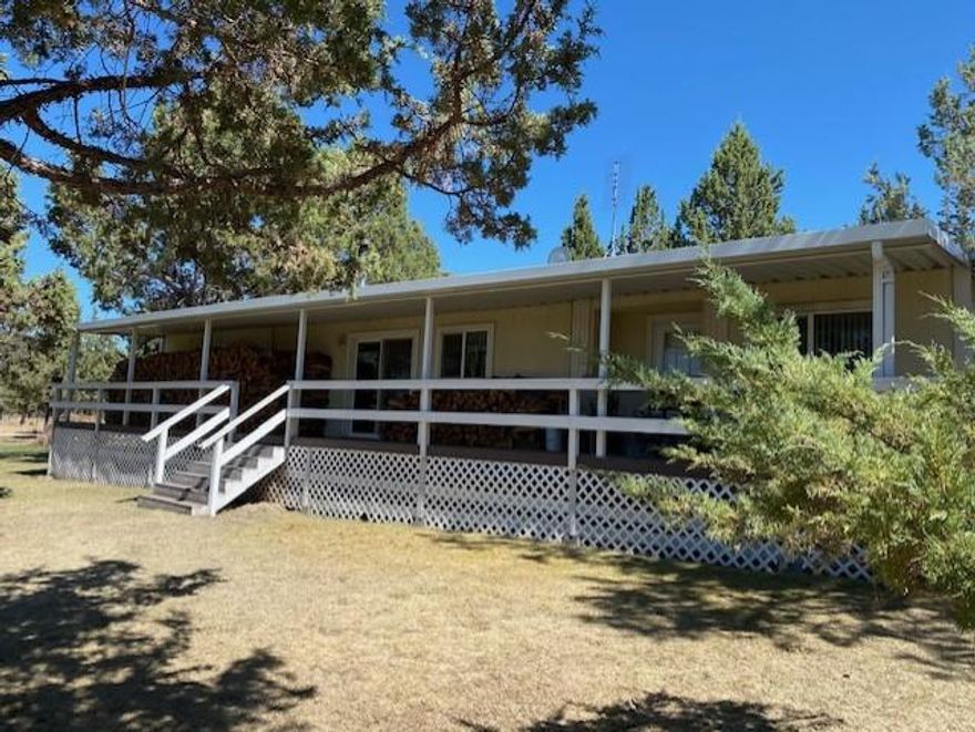 Very special home and horse property in Juniper Heights.  This home has been well loved and cared for over the years.  You'll enjoy the privacy and open space with views of Grizzly Mountain & the natural wildlife that abounds.  2.08 fully fenced acres with 1080 sq ft. barn with 2 horse stalls and a lot of room for hay storage.  Double detached 816sqft garage with work space and wood stove, another separate storage building and so much more!  Must see to appreciate!
