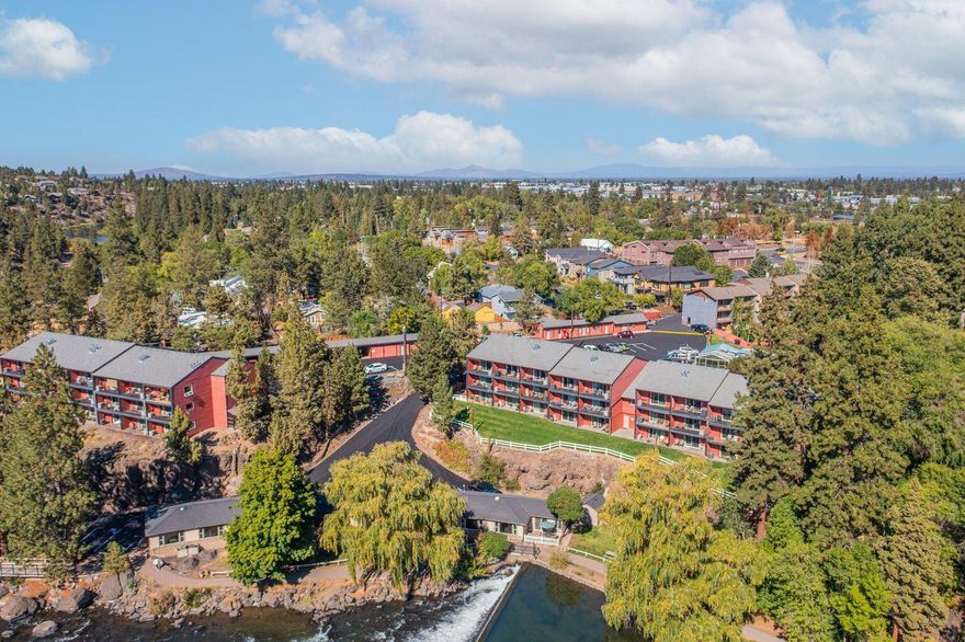 Riverfront condo on Deschutes zoned by city for STR; Riverside Commons is new name of complex converted to condo in 2020.  Spacious unit, full unobstructed view of river in Building ''A'' 2nd floor.  Great room, full kitchen, Two full baths & private bedroom w/2nd exterior door to walkway and privacy locking door.  Great room has Murphy Bed, sofa sleeper, gas fireplace & covered patio overlooking river.  Both rooms have separate heat/AC units.  Complex has large enclosed pool, hot tub, abundant parking & laundry facilities. HOA fees covers all utilities, gas, electric, water, sewer, trash, plus upgraded Wi-Fi.  Covered garage spacers on first come basis. Live here or choose how you manage your rental.  Downtown restaurants, breweries & shopping near complex; enjoy adjacent city park.