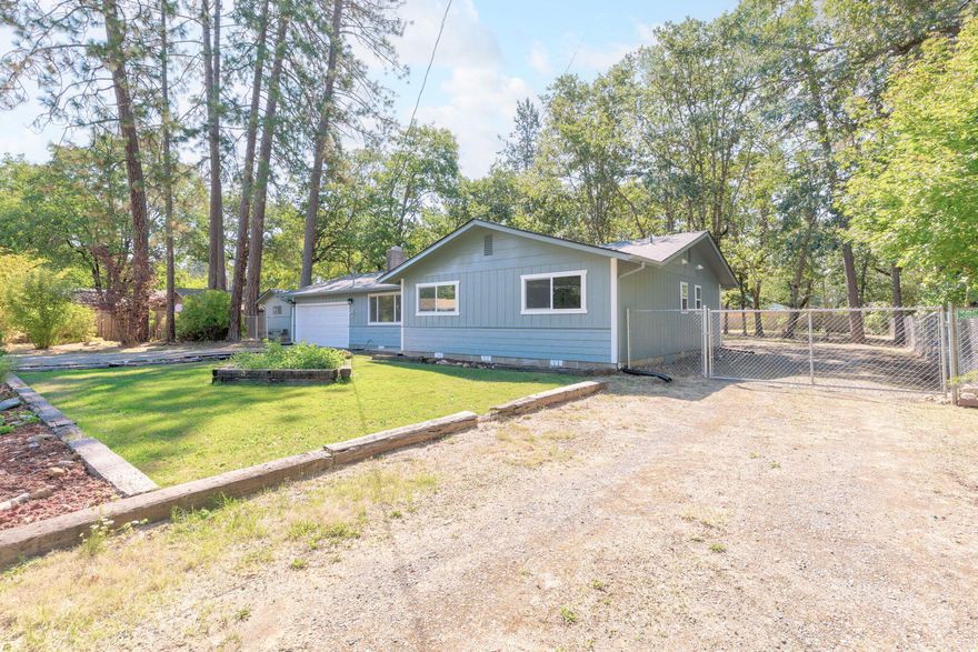 Back on the market NO fault of the property! This beauty is back and better than ever! This three bedroom, two bath home  located in the City of Cave Junction has been through extensive renovations. Check it out- New foundation and subfloor, new vapor barrier, new garage door, new siding, new  exterior and interior paint with fresh texture drywall throughout the home, new carpets in the bedrooms, new flooring in the kitchen and dining room, freshly painted kitchen cabinets,  new custom primary bathroom with tile and easy step  shower. New  toilets, fixtures and lighting, new electrical panel and the back patio will be redone soon!  Brand new roof and updated windows in 2023. Now for the lot! It is a huge lot with a detached shop and plenty of extra room to add an ADU or additional living quarters. Ample RV or boat parking. 214 Millie Street has it all! This home is USDA Eligible! See it today!