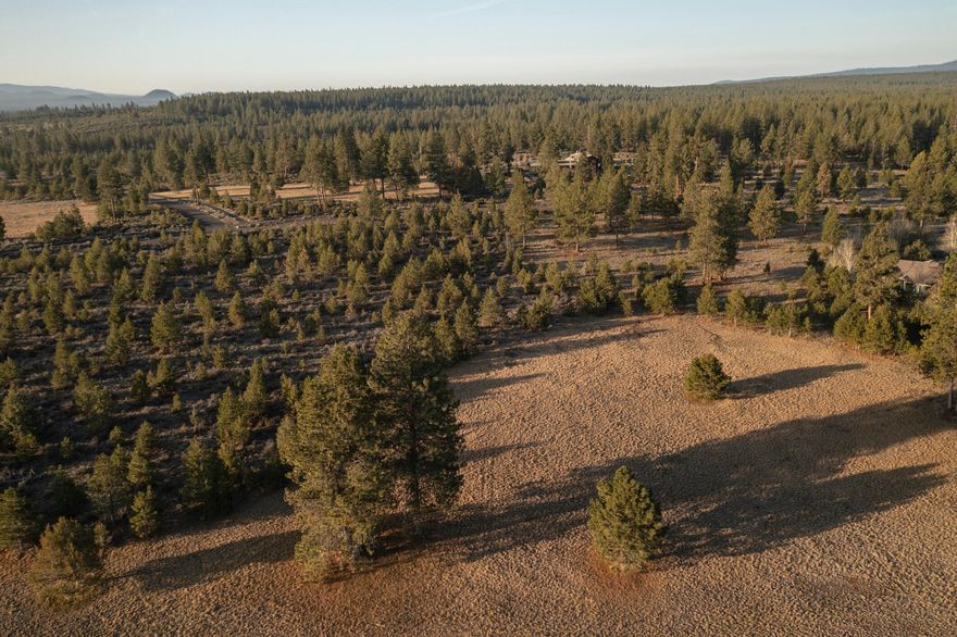 This 10.11 acre parcel is tucked in, away from the bustling of Skyline Ranch Road, with impressive mountain views!  The Highlands at Broken Top is a stunning, exclusive and gated community bordering Tetherow and the Deschutes National Forest. Just moments from downtown Bend, these 500-acres possess around 50 homesites that wind through unmatched and diverse terrain, each being approximately 10 acres in size. Magnificent Cascade Mountain views, solitude and locale are the alluring attributes to this private Bend neighborhood. Close to mountain bike trails, first-class golf and hiking, The Highlands at Broken Top is the epitome of blissful Bend living.