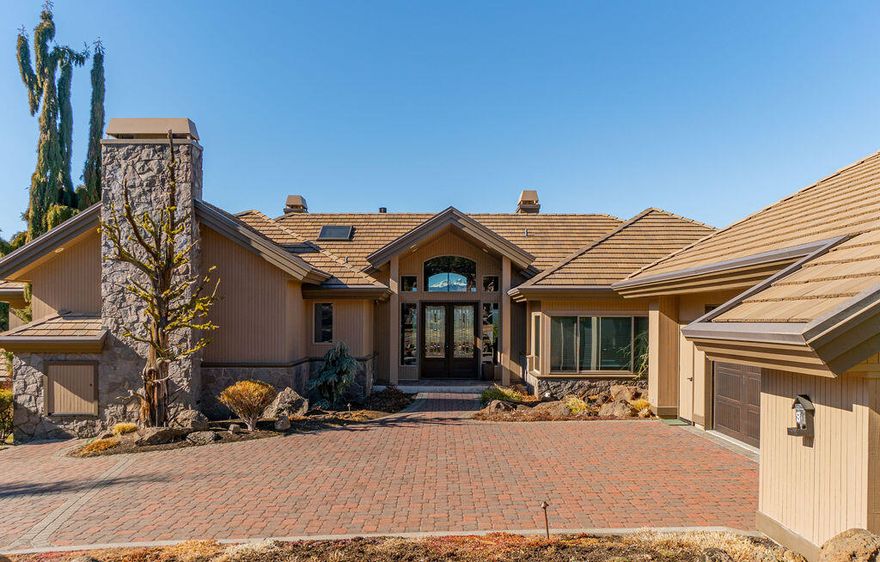 Spectacular views of the snowcapped Cascade Mountains greet you the moment you enter this stunning Awbrey Butte home. Thoughtfully designed & updated by Timberline Construction in 2018, the property showcases views and connection with nature inside & out. The main level encompasses an expansive great room with formal & informal dining areas, open kitchen, custom fireplace, luxurious primary suite, office and large den. Downstairs features two gracious bedrooms & a bonus room, perfect for children or guests. You will love the ability to easily park extra vehicles in the lower garage (with additional shop & storage space!) and 2 more vehicles in the upper garage, all accessed by a heated paver driveway. Professionally landscaped yard with a water feature, pavers, and lovely flowering shrubs. This is a truly extraordinary property, impeccably built to take advantage of its' truly special location in Bend-close to downtown, river trails, Mt Bachelor & all that Central Oregon has to offer!