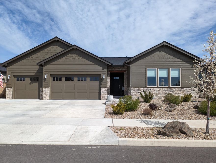 This gorgeous single level home with ADU was custom built and boasts high end, well appointed features. The main home has 3 bedrooms (one being used as a TV room) and 2.5 baths. Custom cabinetry throughout, Mitsubishi splits in the ADU and front bedroom/TV room. Custom lighting throughout, quartz countertops, upgraded high quality carpet in bedrooms and wood look floors. Solid core doors. High quality laminate throughout living areas. (good if you have dogs) The ADU includes a small kitchenette and full bath and is just across the paver patio. Back yard includes a heated patio, gas firepit, water feature, 9 trees and 3 raised & irrigated garden beds. There is a heat n Glow gas fireplace in the great room and electric fireplaces in the front bedroom/TV room and in the ADU. The large pantry includes cabinets with plug ins to keep kitchen counters clear. This quiet neighborhood is in a great location with easy access to highways 97 or 26 Only 15-20 minutes to Bend. Mtn Views.