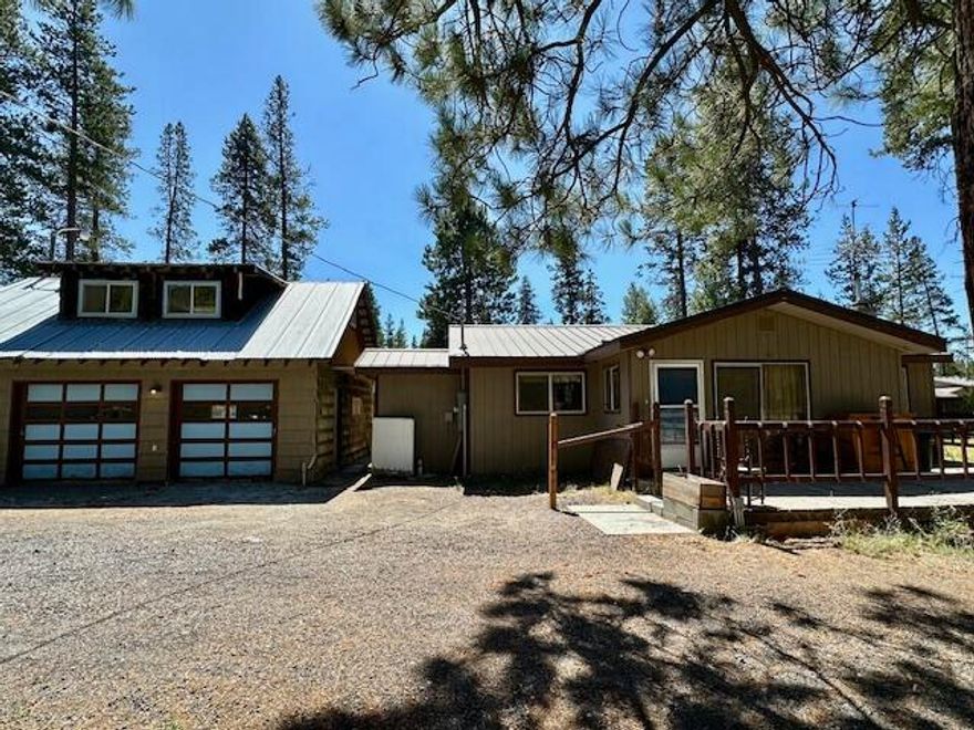 Discover the charm of Central Oregon living with this 2-bedroom, 1.5 bath, 1280 sqft home on 1.25 acres. The spacious primary suite features an office and a huge walk-in closet. Open floor plan, pellet stove and 3 ductless heat pumps. A spacious kitchen perfect for everyday living. This home also includes an oversized 2 car garage with a workshop area. Above the garage, a large bonus room can be used as a game room, hobby space, or guest accommodations. Other outbuildings, green house and RV dump on site, circular drive way. A new well was installed on April, 2025.  Priced to sell. Sold As Is and Where Is. Bring your tools and imagination to make this home truly your own.