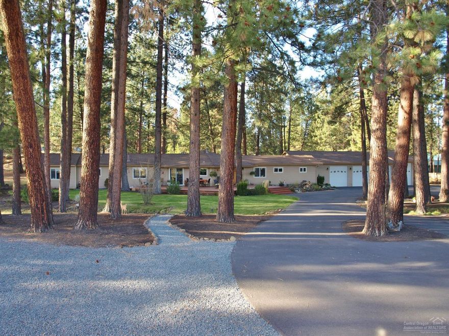 Single level quite & private horse ranch nestled in the trees-park like setting on 6.1 acres with 3 acres irrigated water & underground timed system. Large lined pond, dry lot, small barn, 2 larger graveled parking area, 2 fenced pastures, dry lot, small barn, seasonal irrigation canal running thru property. Gorgeous front deck, rear deck, detached hobby house w/wrap deck, 3 propane FP. Oversized 4 car insulated garage with shop area and 2 storage closets. Close to riding are. This property has it all!