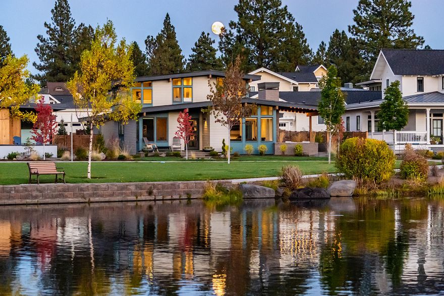 Absolutely stunning Mid-Century Modern home in Northwest Crossing with breathtaking views of both Discovery Park and Discovery Lake in NW Bend. Beautiful contemporary styling in this open great room floor plan with 3 bedroom, 2.5 bath, 2696 sqft home with designated office and spacious bonus room carefully constructed by Structure Home Builders. Features include a chef's island kitchen with slab quartz countertops, professional series stainless steel appliances, custom cabinetry, and large pantry. Abundant natural light in the great room including vaulted ceilings, plank hardwood floors, gas fireplace, and built-ins. Main level master suite with double vanity and tile shower. Generous secondary bedrooms and ample bonus room on the second story. Amazing outdoor living space is perfect for entertaining including covered patio and open pergola. Close to restaurants, trails, schools, and recreation. This is truly a spectacular property. Call your broker for a private viewing today.