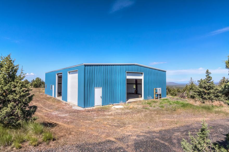 Live on Top of The World!  An absolute must see. This property provides for the most spectacular Cascade mountain Views, from Mt. Hood to Mt. McLoughlin, including a breathtaking, front and center view of Mt. Jefferson with Smith Rock in the foreground.  Stunning.  Property has all the infrastructure - Well, IN! Septic, IN! Electric, IN! Including a 3850 SF shop with unfinished apt inside! Floor plans for the completion of the apartment and 2nd floor office included in the sale, along with additional building materials already purchased.  Not only that, but the site above the shop has already been cleared for a triple wide mani, or build the home of your dreams! Very private and quiet with multiple possible uses. 
Building specs: 54x70x16 clear span steel building made by General Steel Corp. 3-14' roll up doors, 3 man doors and 7 windows. Meets all snow, wind and earthquake codes and is insulated. Baths for apt and office already plumbed, buyer to finish.