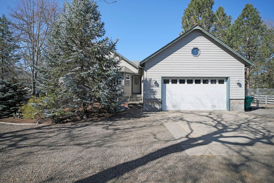 Enjoy spectacular views of the Rogue River from your private patio and dock in this quiet little neighborhood of Shady Cove. Impeccable custom-built home is single story w/ over sized garage and walk-in under-structure. Kitchen has double ovens, a warming drawer, wine refrigerator, instant hot water, water filtration and pantry. Enjoy your morning coffee in the breakfast nook as you look out onto the water. The kitchen and breakfast nook are open to the living room with vaulted ceiling and recessed speakers and a beautiful river rock propane gas see-through fireplace. The formal dining room opens through glass double doors. The master bedroom has sliding doors to covered patio and spa, large walk-in closet and the see-through fireplace. The master bath has a walk-in shower and double sinks. One bedroom with no closet is being used as an office next to master. Second bedroom and bath are on the opposite end of the house. Beautiful covered deck with path to the river.