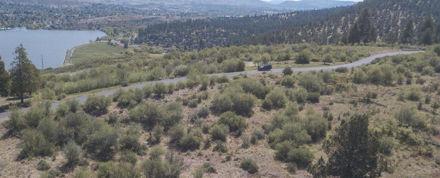 Step into nature with this beautiful level lot nestled within RidgeWater's gated community. Known for its quality craftsmanship, quiet surroundings, and scenic trails, RidgeWater offers a lifestyle that blends natural beauty with a welcoming sense of community. Take in breathtaking views of the mountains, Klamath Lake, Mt. Scott, and Buck Island as you explore the community's trails and paved paths. With 250 acres of open space and outdoor adventure right outside your door, this is the perfect setting to build your dream home and enjoy a peaceful, private retreat.