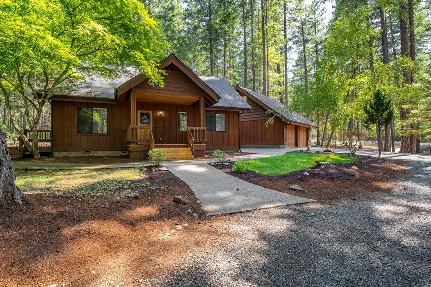 Welcome to your private woodland retreat an idyllic 1,296-square-foot home, built in 1989, tucked beneath towering evergreens on 2.51 secluded acres. Thoughtfully designed to capture the magic of forest living, this two-bedroom, one-bath sanctuary melds charm with modern comforts. Key Features: Vaulted Ceilings, oil heater, new stainless-steel appliances, tile kitchen counters, detached 2-Car Garage with a non permitted finished room above with 1/2 bath.