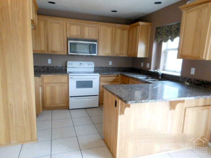 SOLD-AS-IS-See attached docs for more information on $500 credit toward Home Warranty of buyers choice. Buyer must request home warranty credit on the offer, it is not automatically given. New carpet, dishwasher and range, new interior paint. Fenced .21 acre lot with deck in the back.