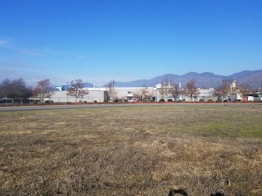 Get Your Business Seen! Visibility Equals Revenue! One of the Highest Traffic count in Josephine County! Frontage on all sides! Grants Pass Parkway, M. Street and Mill Street. Forget exposure, this is ultimate visibility! This property is zoned Business Park Commercial which allows for many business uses and opportunities. When your business is on one of the busiest intersection in town you don't get missed! Buyer to do their own due diligence as to uses and restrictions for their intended use.