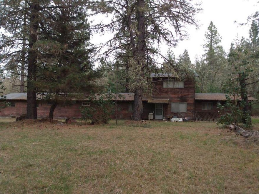 2 acres with a large shop, water, and power ready for your renovation to become whatever it is you're dreaming of. At one point this was a 1672 square-foot home with attached shop and quite a few years ago the septic system had a repair permit. Nobody has looked into that for a while. But if you are looking for a project this building lot off of New Hope has a lot of exciting potential. Make sure to come check it out with your imaginative and creative mindset The sky is the limit on possibilities here.
If your dreams need more than 2 acres a neighboring 2 acre building lot right off New Hope is also available for sale.  And another neighboring lot of over 11 acres.  (Those listings will include a two bedroom two bath home.)