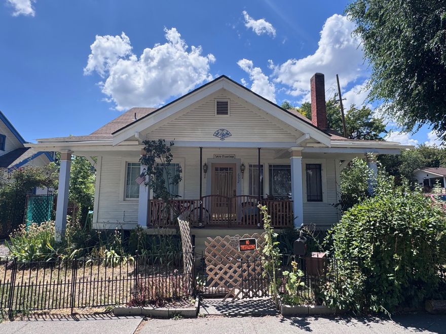 Income-producing multi-unit property with excellent rental history! 6.6% cap with low risk! 2,575 sq.ft. home on a 0.12-acre corner lot offers 3 furnished bedrooms, large upstairs suite, & a full downstairs apartment. Ground floor includes 3 large bedrooms with refinished oak floors, built-ins, porches, & shared baths. Basement bedroom has egress, utility sink, & exterior exit. Upstairs suite features a large bedroom, living space, kitchenette, porch, & garden window. Downstairs 700 sq.ft. apartment offers full kitchen, bath, living room, office, & fenced garden. Recent upgrades: A new furnace was installed in December of 2025, modern electrical panels, new freshwater/sewer lines, grey water plumbing, LVP/tile flooring, new paint, 2 electric water heaters. Mature gardens, patio, greenhouse, storage, & more. Home is 3 blocks from downtown. Perfect for investors, multi-generational living, or owner-occupied income property.